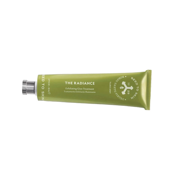 Green tube of 'The Radiance' exfoliating clay cleanser on a white background