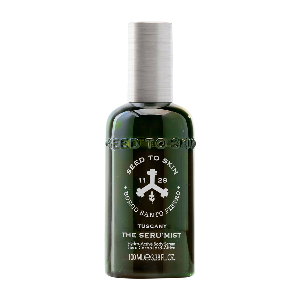 Seed to Skin Tuscany The Seru'mist hydro-active body serum in a dark green bottle with a white cap, on a white background.