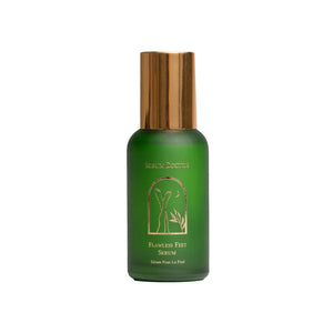 A green bottle of Serum Doctor Flawless Feet Serum with a metallic gold cap and gold lettering, set against a plain white background.