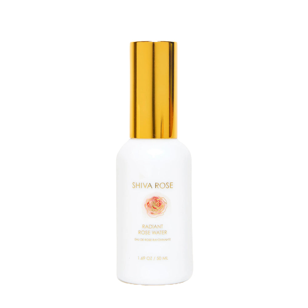 A white bottle of Shiva Rose Radiant Rose Water with a shiny gold cap, centered on a plain white background.