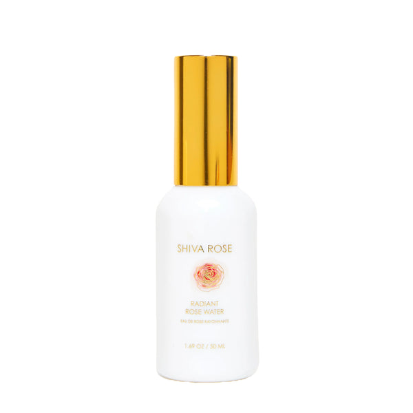 A white bottle of Shiva Rose Radiant Rose Water with a shiny gold cap, centered on a plain white background.