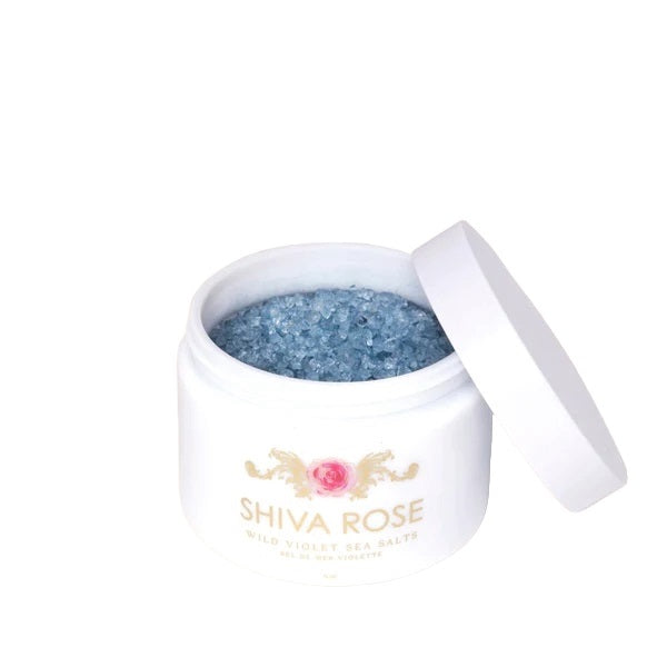 Shiva Rose Wild Violet Sea Bath Salts in a blue hue, infused with Epsom salts, spirulina, and butterfly pea flower, offering a relaxing and calming bath experience.