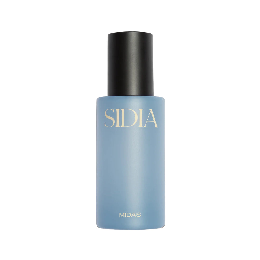 Blue bottle of SIDIA The Body Mist in scent Midas on white background
