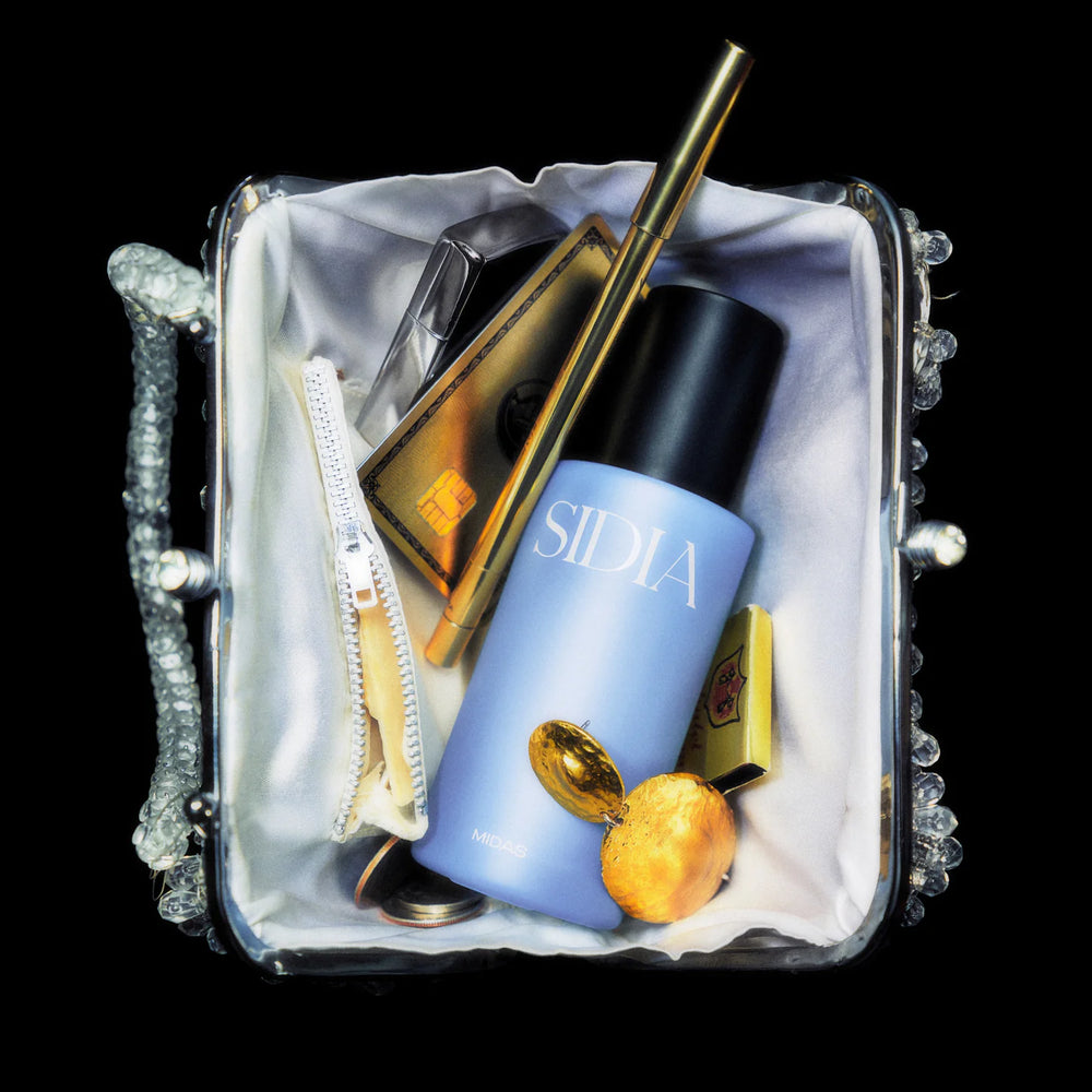 Blue bottle of SIDIA The Body Mist in scent Midas on white background