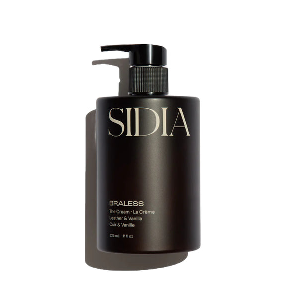 SIDIA BRALESS Cream hand and body moisturizer in a bottle with a black pump, a rich yet quick-drying cream with coconut, soft woods, and leather-inspired fragrance notes.