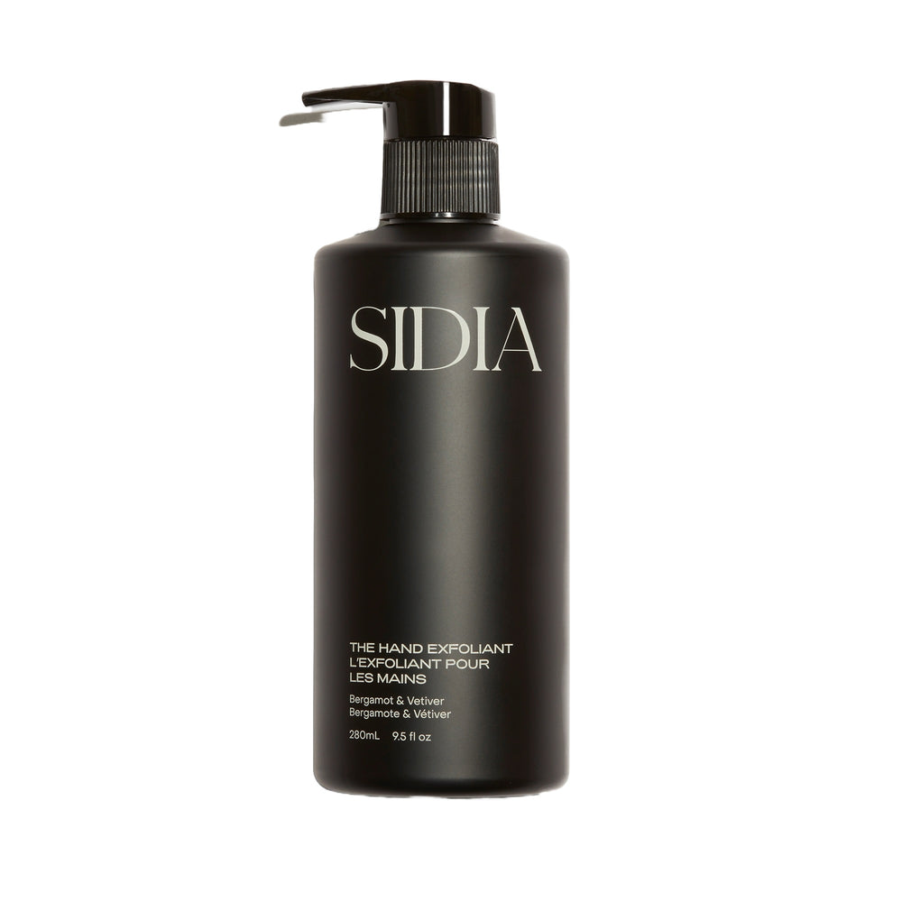SIDIA The Hand Exfoliant in a sleek bottle, featuring nourishing ingredients like avocado oil and rambutan, with soothing Bergamot and Vetiver scent.