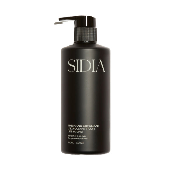 SIDIA The Hand Exfoliant in a sleek bottle, featuring nourishing ingredients like avocado oil and rambutan, with soothing Bergamot and Vetiver scent.
