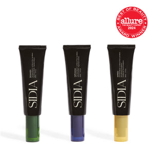 Three black SIDIA hand cream tubes with colored ends on a white background, featuring the Allure Best of Beauty 2024 award logo.