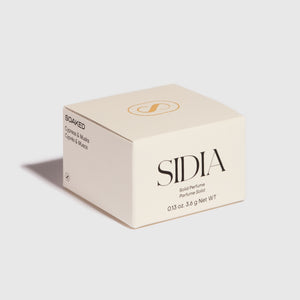SIDIA solid perfume packaging on a light gray background