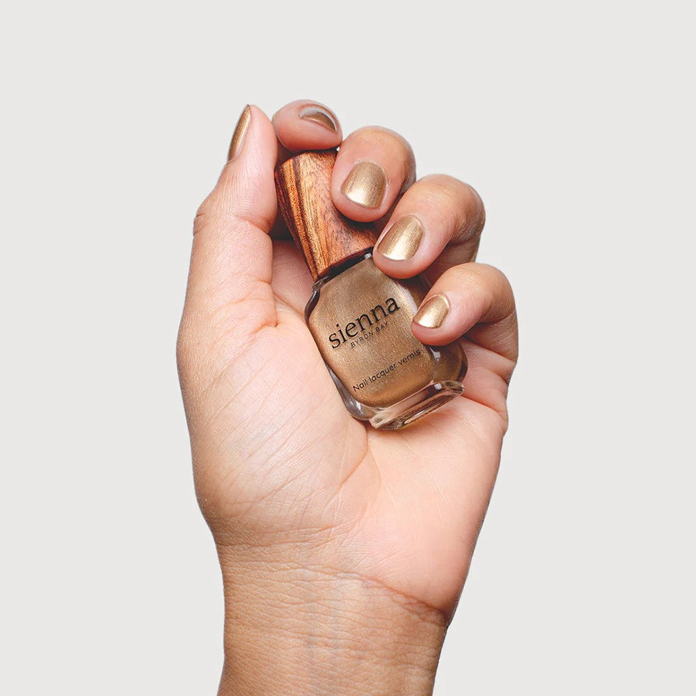 Sienna Byron Bay Divine Nail Polish – luminous gold shade in eco-friendly packaging.