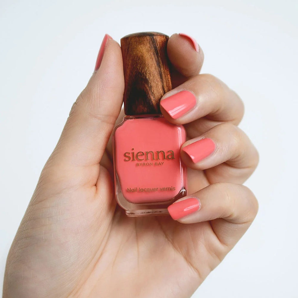 Sienna Byron Bay Laughter Nail Polish in a bright grapefruit sorbet crème shade with eco-friendly packaging.