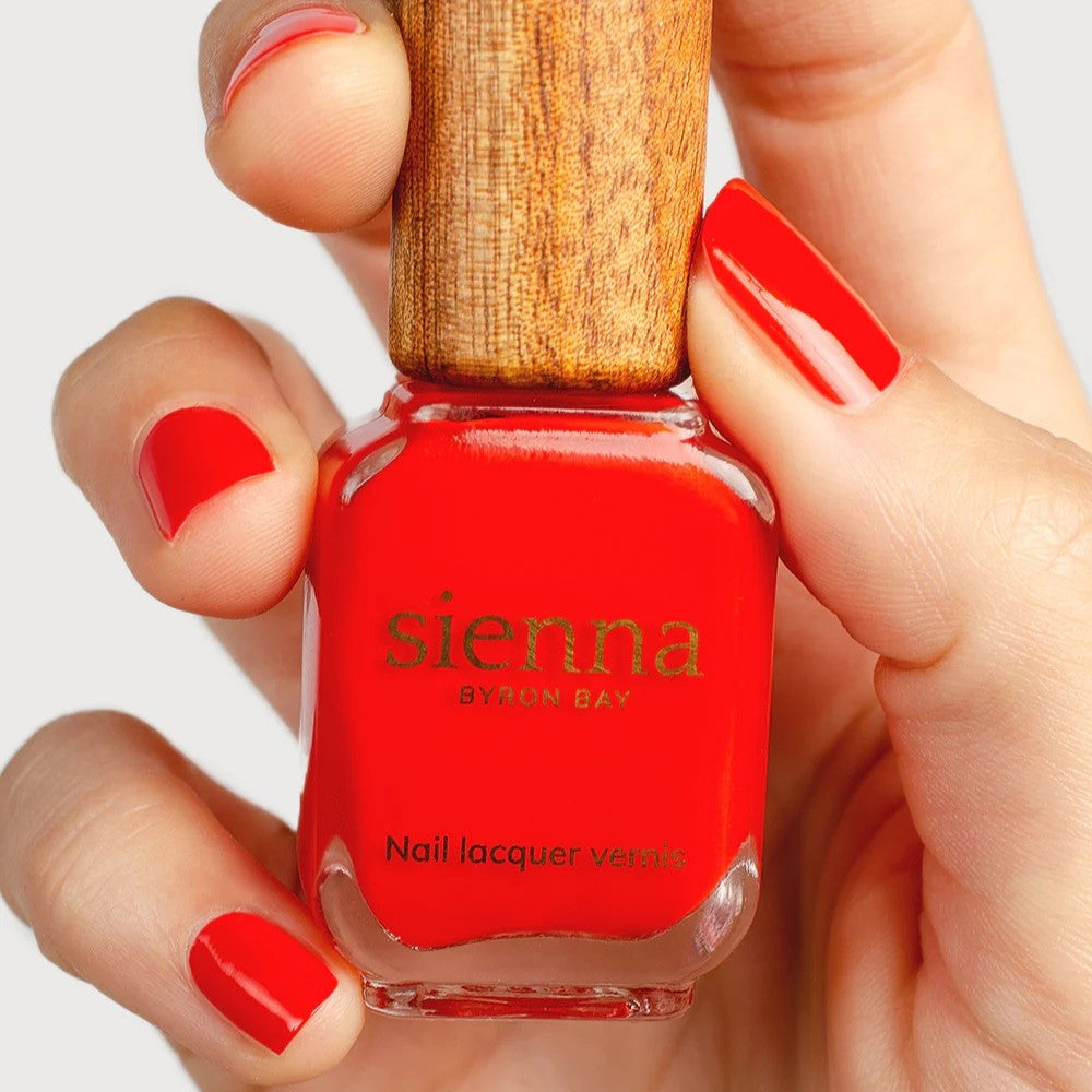 Sienna Byron Bay Passion Nail Polish in Intense Vermilion Crème, a brilliant vermilion red, eco-friendly, vegan, and cruelty-free.