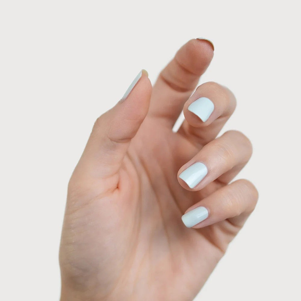 Sienna Byron Bay Renewal Nail Polish in a delicate light sage crème shade with sustainable packaging.