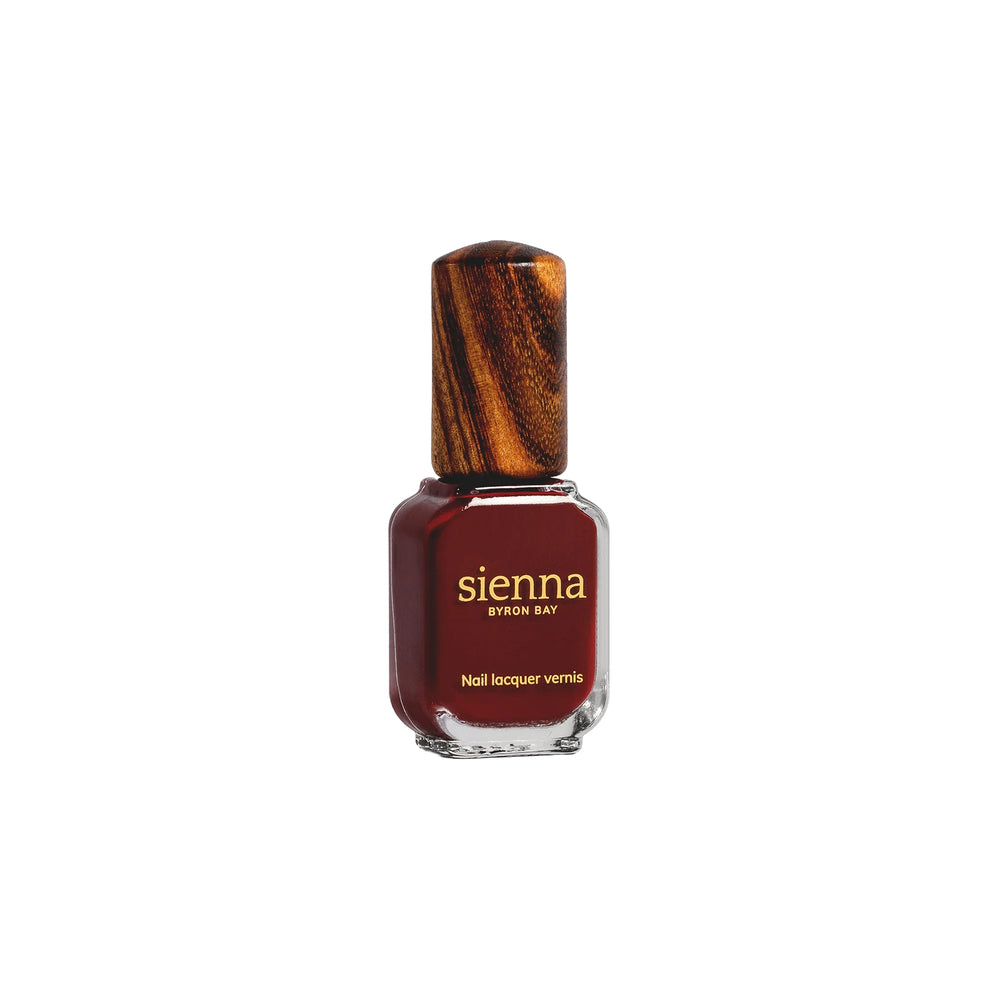 SIENNA BYRON BAY Sacred Nail Polish in Garnet Crème – a deep, organic red with a smooth crème finish.
