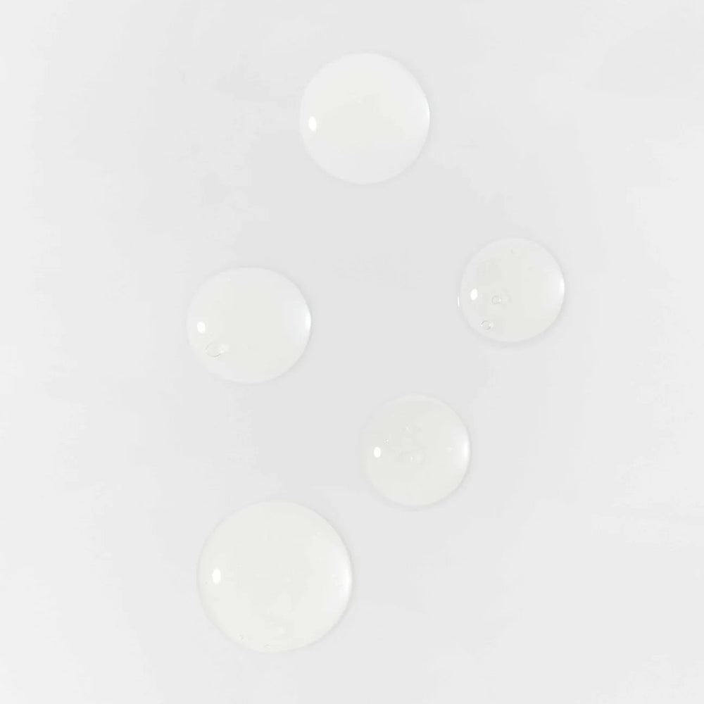 Susanne Kaufmann Ectoin Serum – Lightweight serum with ectoin, coenzyme Q10, and purple algae extract for protection and hydration.