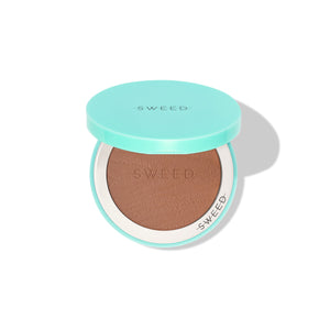 Compact bronzer in a teal case with 'SWEED' branding on a white background