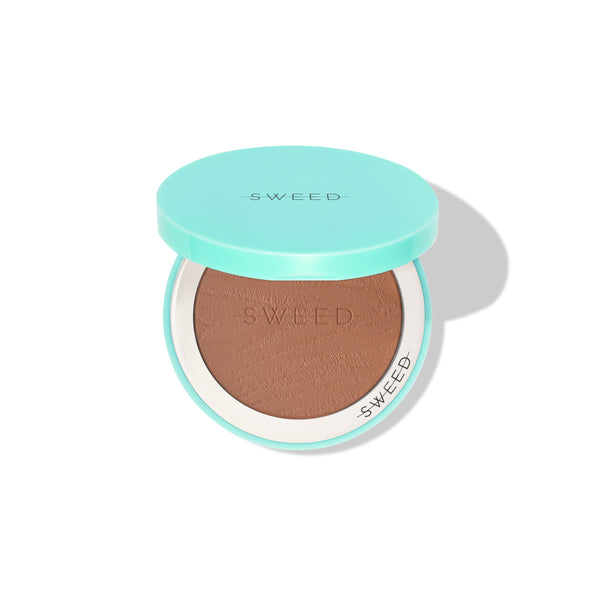 Compact bronzer in a teal case with 'SWEED' branding on a white background