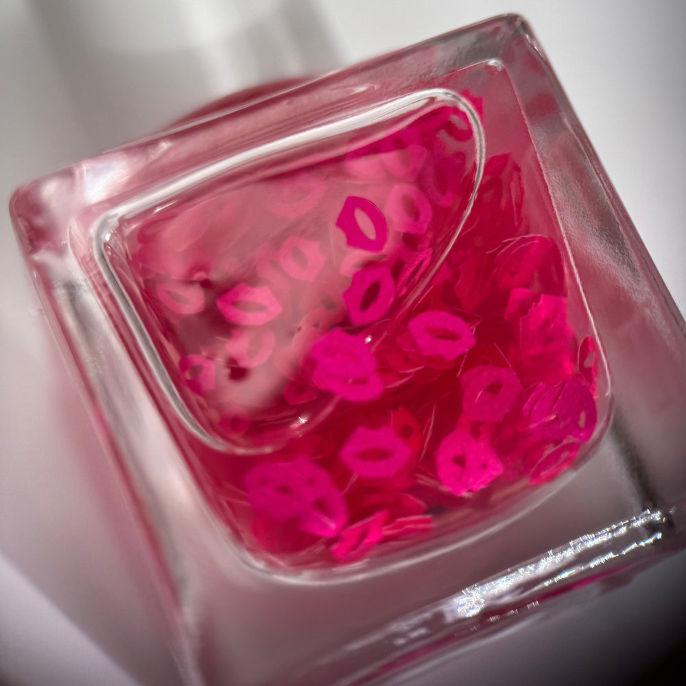 TENOVERTEN Nail Polish Bisou with sheer jelly finish and hot pink lip decals.