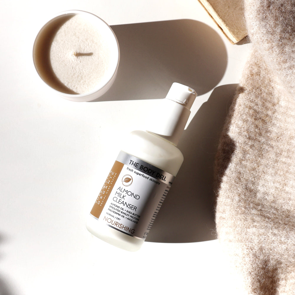 THE BODY DELI ALMOND MILK Cleanser – ultra-rich nourishing facial cleanser for dry skin with almond oil, shea butter, and botanical extracts in a 4oz bottle.