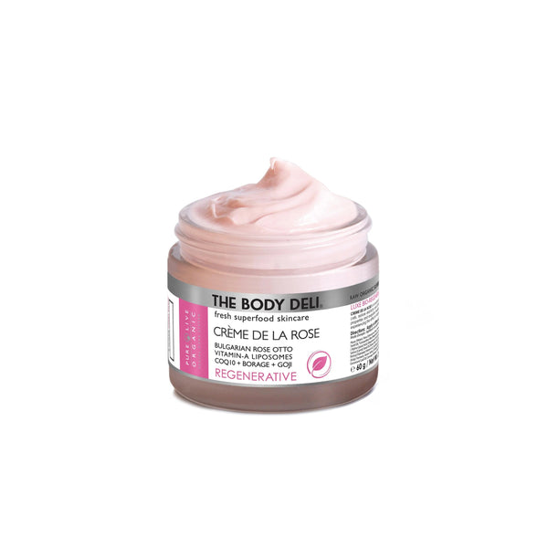 Jar of THE BODY DELI Crème de la Rose facial moisturizer on a white background.