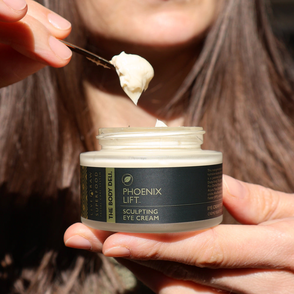 Jar of THE BODY DELI Phoenix Lift Sculpting Eye Cream with plant-based anti-aging ingredients for firming and hydrating the eye area.