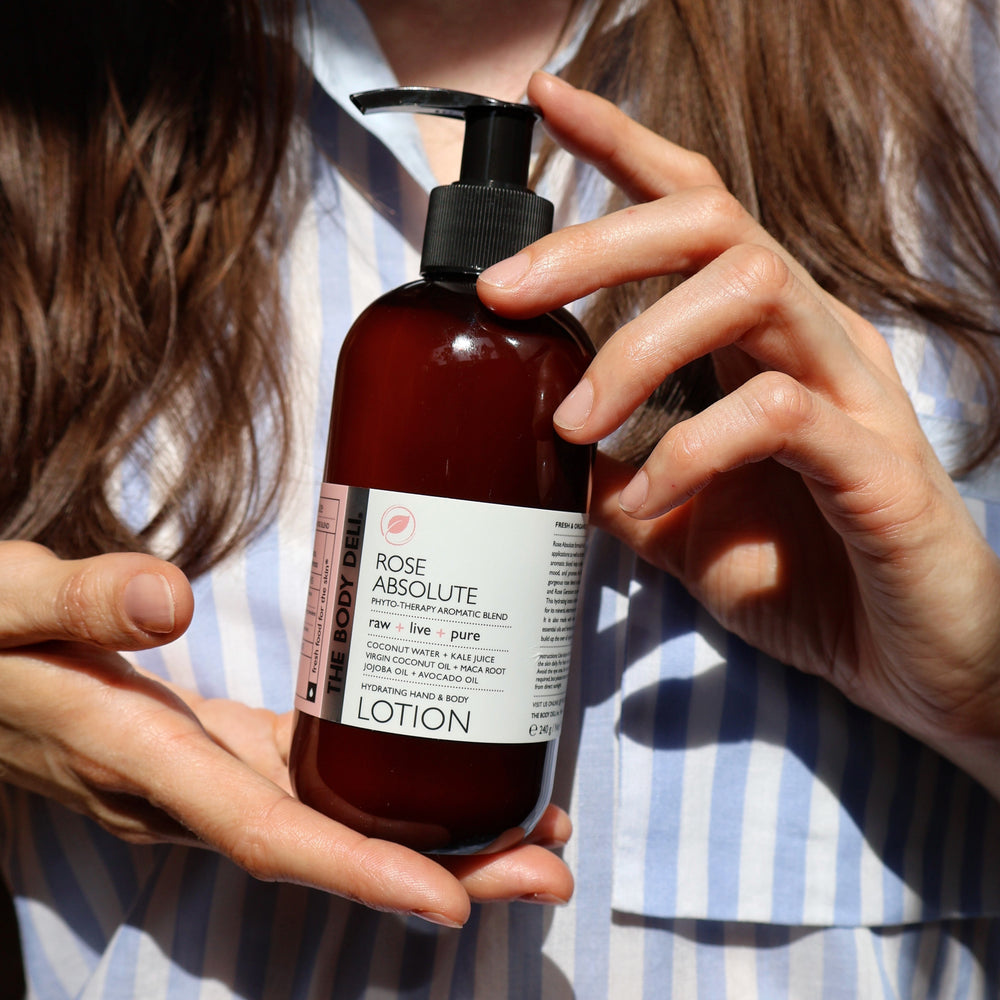 THE BODY DELI Rose Absolute Hand & Body Lotion bottle with Bulgarian rose and organic superfood ingredients, designed for deep hydration and soft skin.