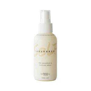 SELF-ABSORBED Dry Shampoo + Texture Spray by The Daily Hair Company in a sleek spray bottle, designed to refresh and volumize hair with a natural citrus and mint scent.