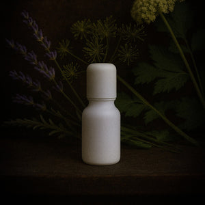 Tidelands House Grain D'Aneth & Lavande Huile de Parfum No. 2 botanical perfume oil in milk glass roller bottle with dark background