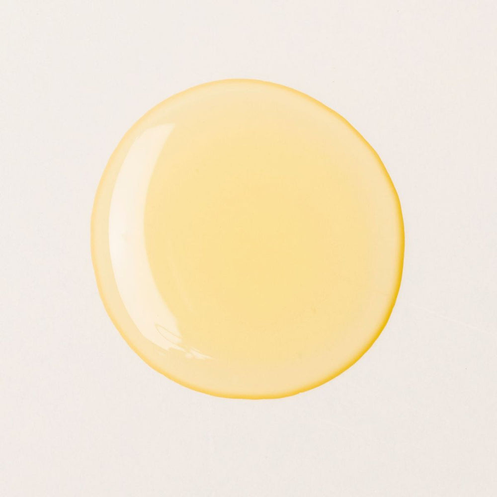 Red bottle with 'Tronque' branding on a white background. TRONQUE Vitamin C Body Oil