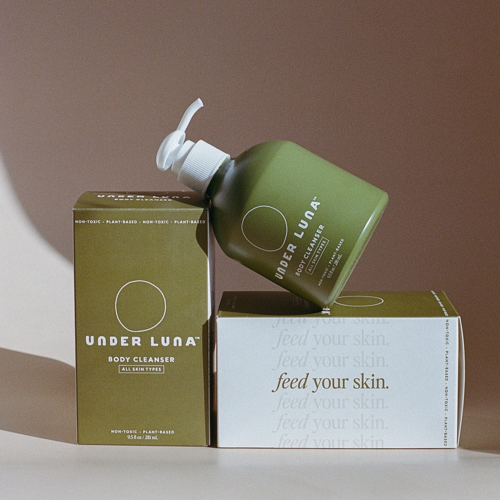 UNDER LUNA Body Cleanser in a recyclable aluminum bottle, featuring a hydrating aloe vera-based formula with antioxidant-rich orange, blueberry, and coconut extracts. Ideal for all skin types.