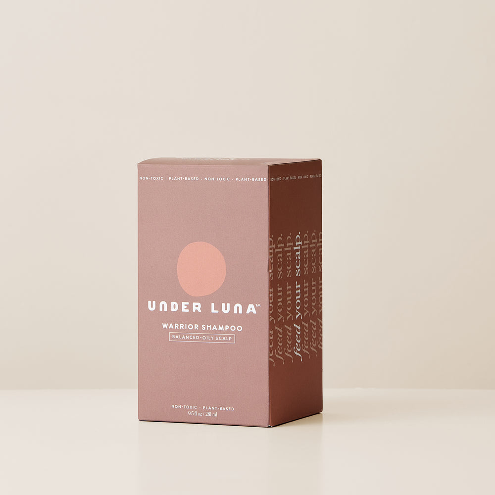 Under Luna Warrior Shampoo in recyclable aluminum bottle with sage and citrus aromatics, designed for oily to balanced scalps.