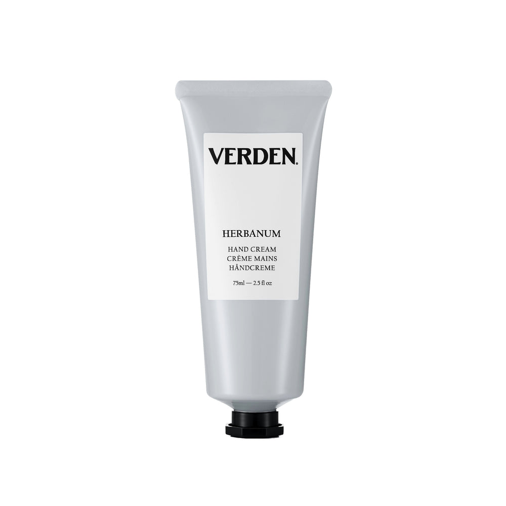 A silver squeeze tube of VERDEN Herbanum Hand Cream with a white label and black cap, centered on a white background.