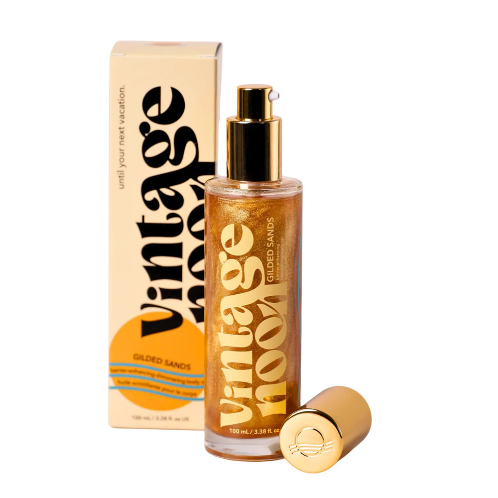 Bottle of Vintage Noon Gilded Sands Body Oil with dual layer shimmer on white background