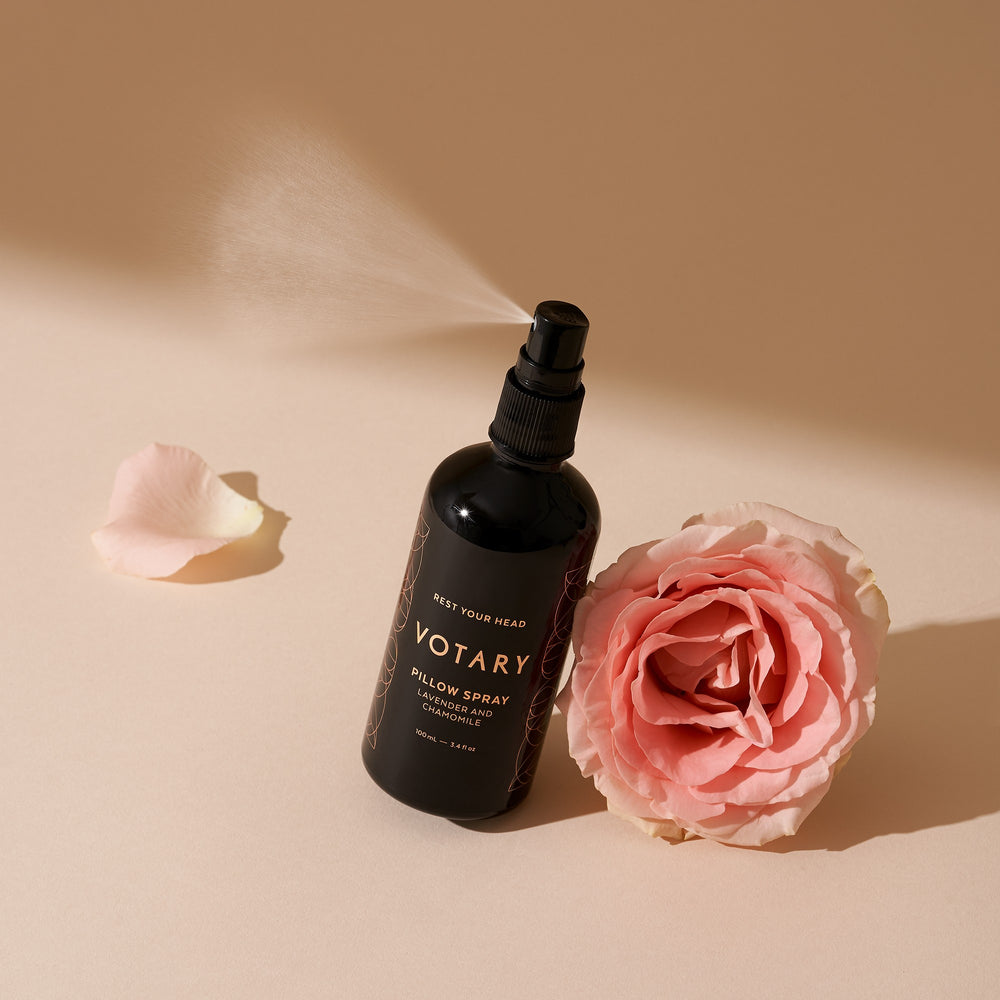 Black bottle of Votary pillow spray on a white background