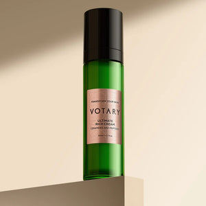 Green bottle with black cap and pink label on a beige background. VOTARY Ultimate Rich Cream