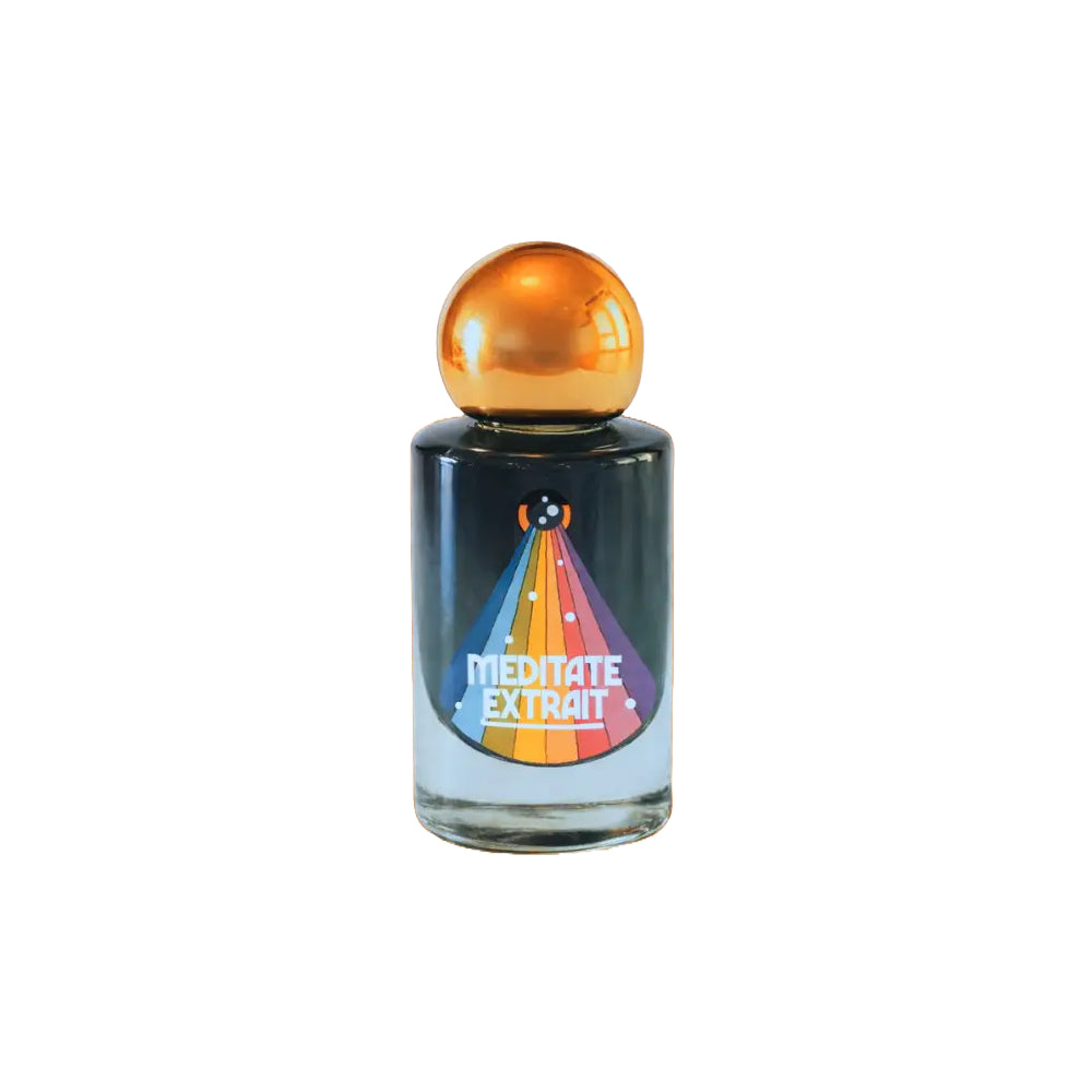 A bottle of Meditate Extrait fragrance with a dark glass body, a metallic gold spherical cap, and a colorful rainbow party hat graphic on the front.