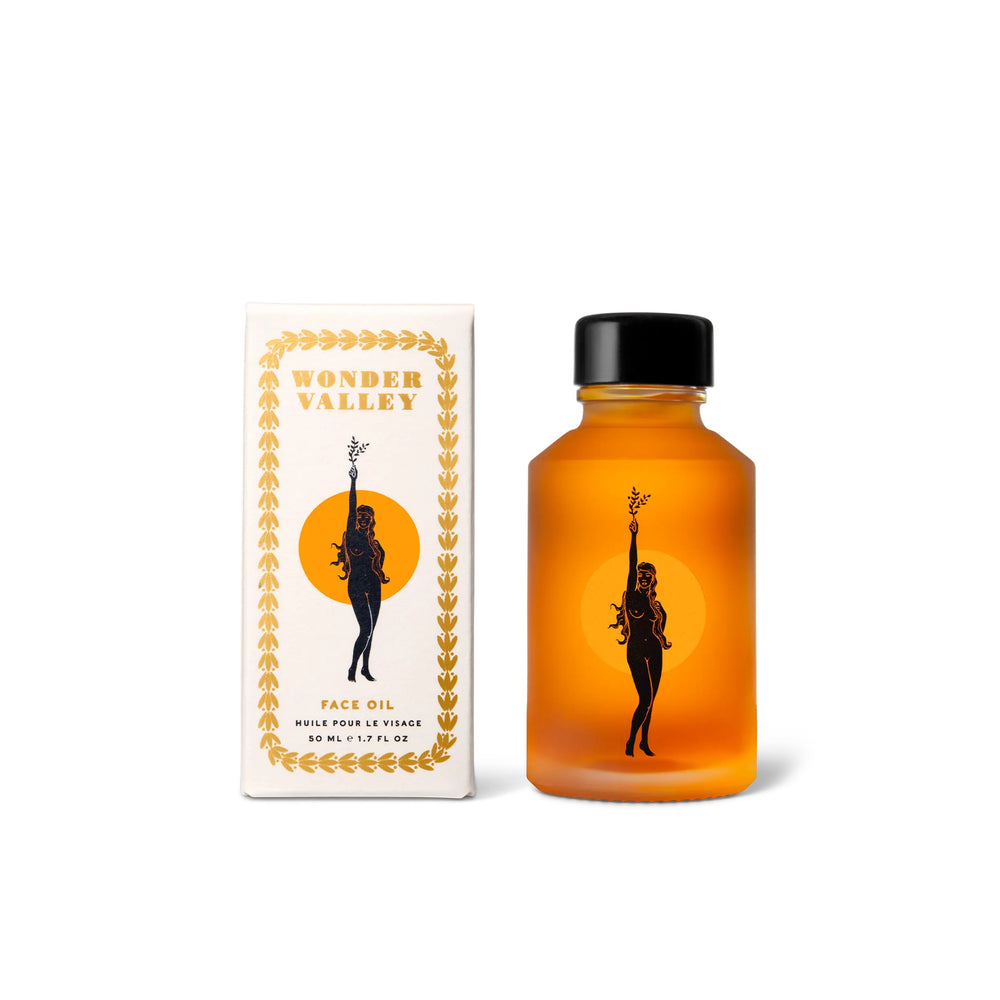 Orange bottle with black cap and silhouette design next to a white box with similar design elements on a white background