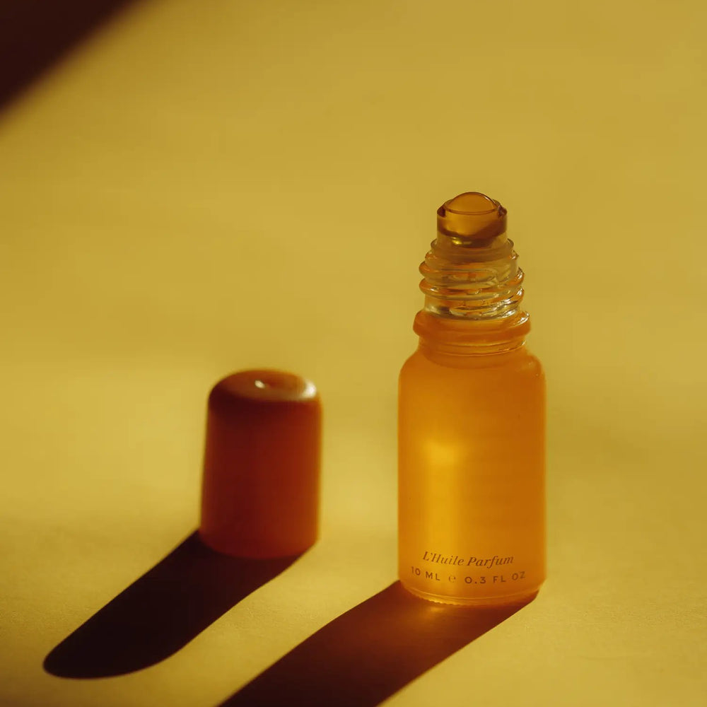 Wonder Valley Hinoki Roller essential oil perfume with hinoki, cedarwood, and fir in a sleek glass rollerball for grounding, wearable scent.