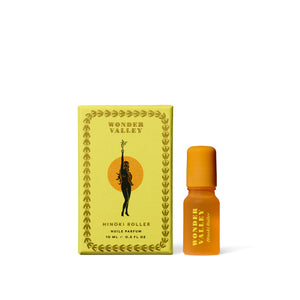 Wonder Valley Hinoki Roller essential oil perfume with hinoki, cedarwood, and fir in a sleek glass rollerball for grounding, wearable scent.