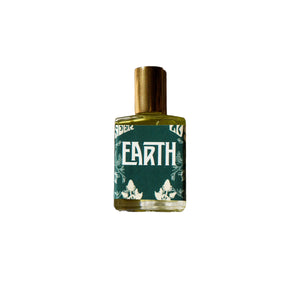 Wonderlust Botanicals Earth Oil Perfume – unisex aromatherapy blend with patchouli, cinnamon, and black pepper essential oils in a roll-on bottle.