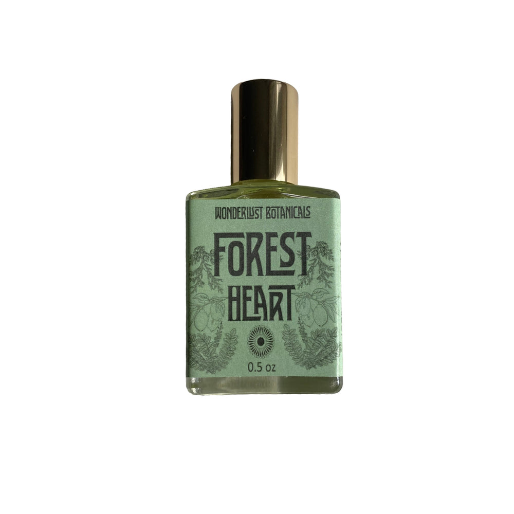 Wonderlust Botanicals Forest Heart perfume oil with a fresh, woodsy and citrus scent, featuring essential oils and infused with Aventurine crystal in grapeseed oil.