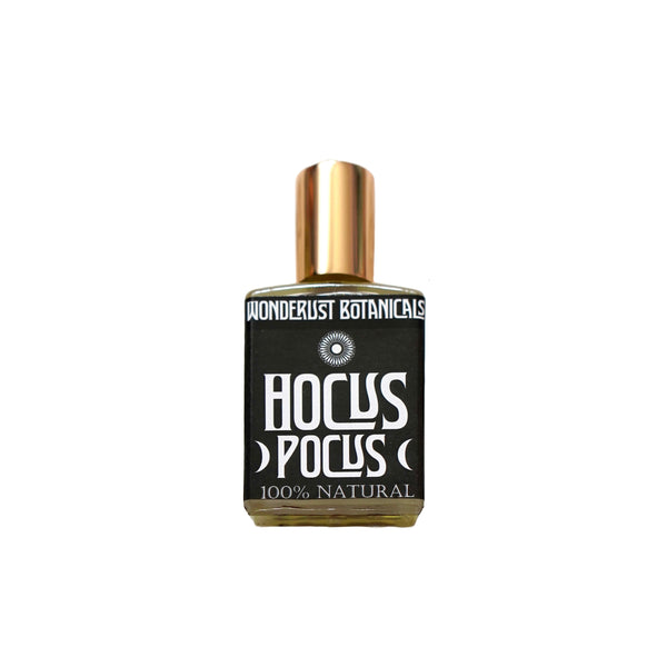 Wonderlust Botanicals Hocus Pocus Perfume Oil in a 0.5 oz roll-on bottle, offering a warming floral and spice blend with a touch of bergamot.