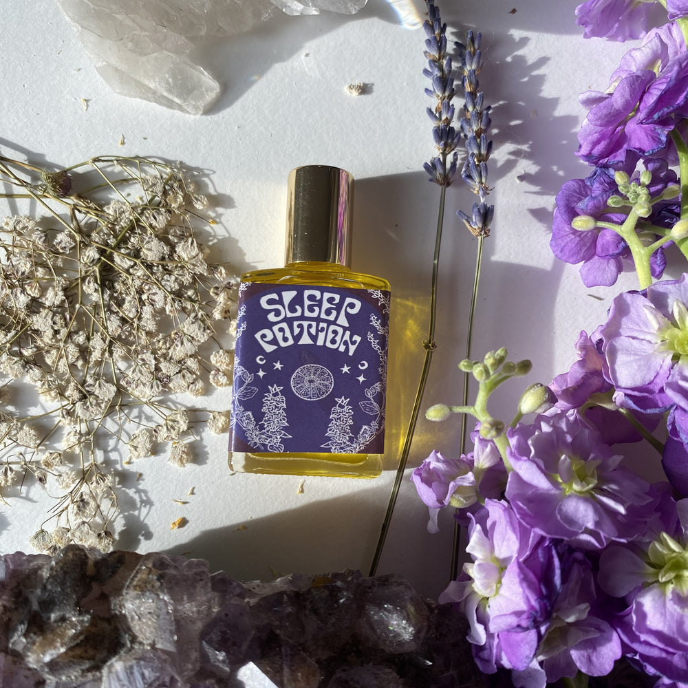 Wonderlust Botanicals Sleep Perfume Oil in a 0.5 oz roll-on bottle, featuring a calming floral blend.