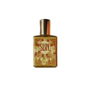 Wonderlust Botanicals Citrus & Patchouli Perfume Oil in a 0.5 oz roll-on bottle, offering a fresh and energizing blend of citrus and patchouli.