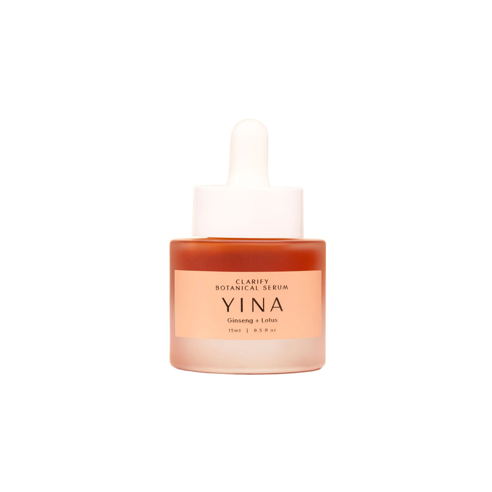 YINA Clarify Botanical Serum in clear matte glass bottle with pastel orange label and white pipette on white background