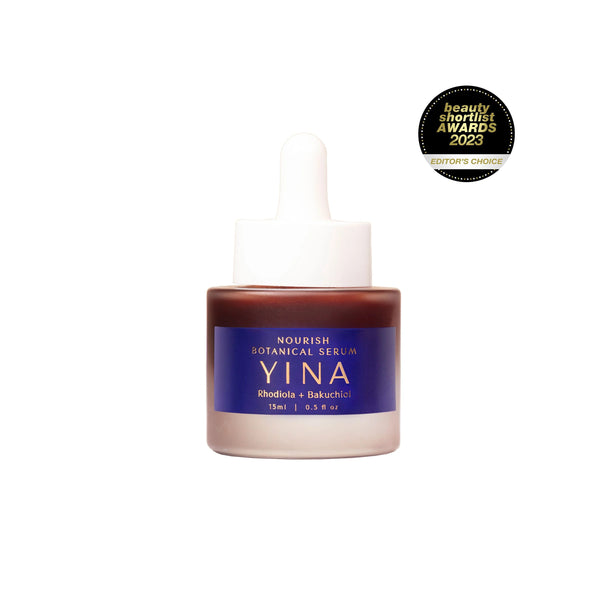 YINA Nourish Botanical Serum in clear matte glass bottle with dark purple-blue label and white pipette on white background
