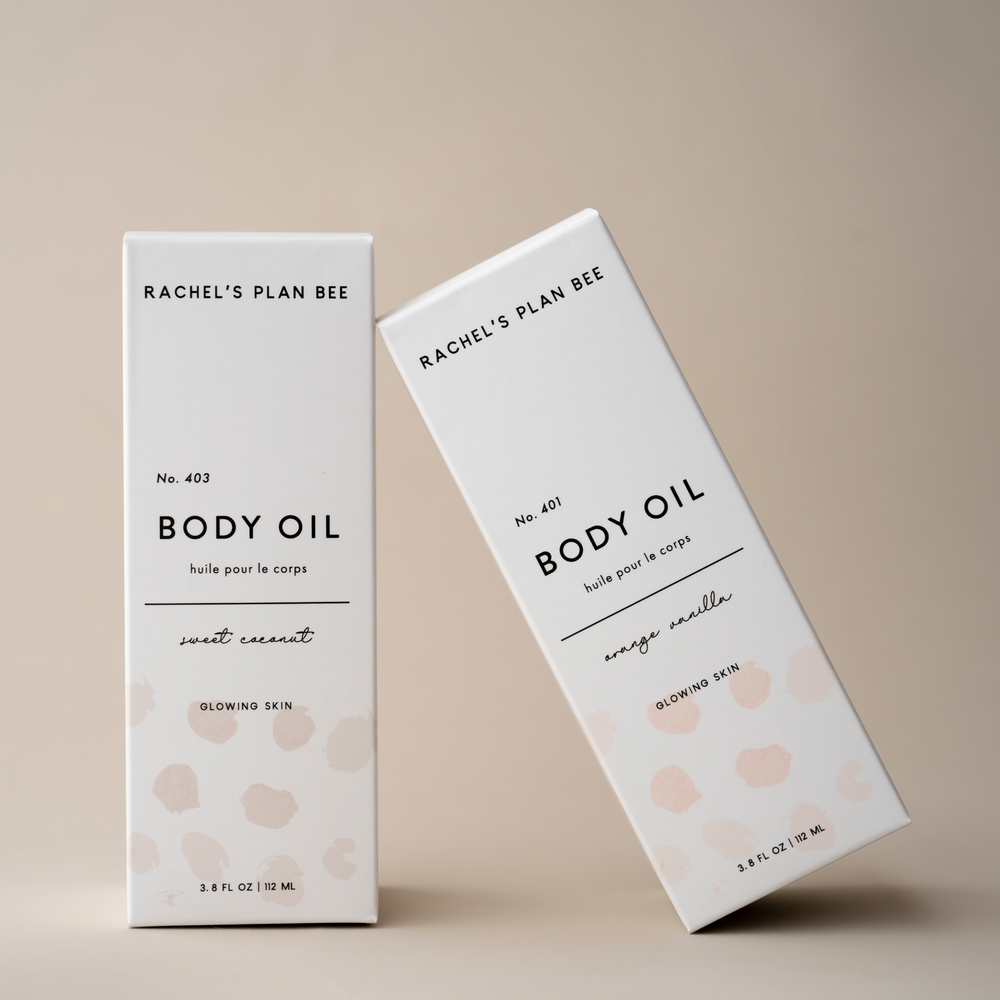 Glass pump bottle of Rachel’s Plan Bee nourishing body oil with citrus and vanilla scent