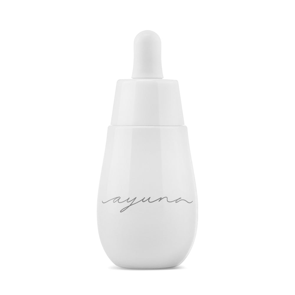 AYUNA cellular oil in white glass bottle with white pipette on white background