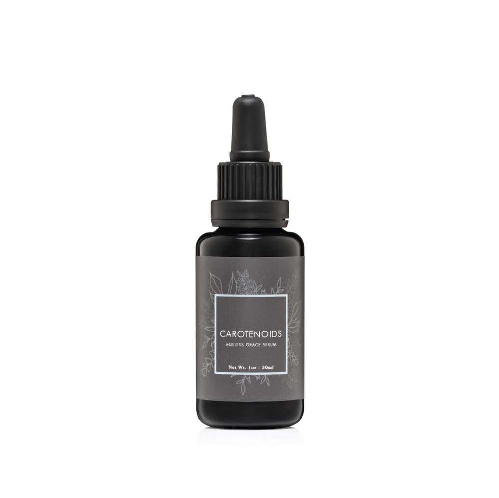 CREATION CAROTENOIDS Regenerative Serum in a glass dropper bottle, a vibrant, vitamin A–rich facial oil designed to brighten, protect, and restore skin radiance.