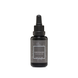 CREATION CAROTENOIDS Regenerative Serum in a glass dropper bottle, a vibrant, vitamin A–rich facial oil designed to brighten, protect, and restore skin radiance.